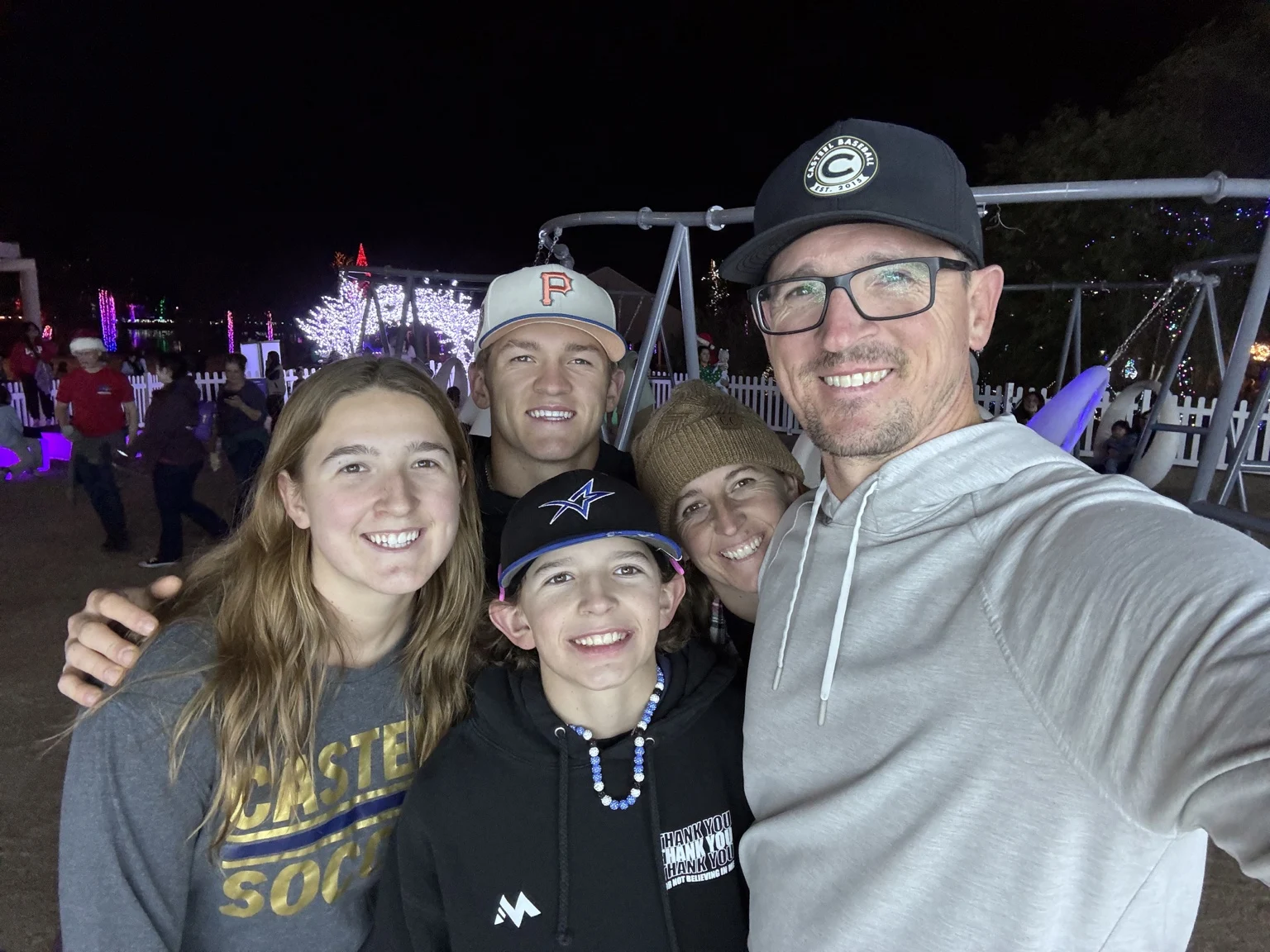 Brandon, Chantel and the kids smiling together at an evening outing