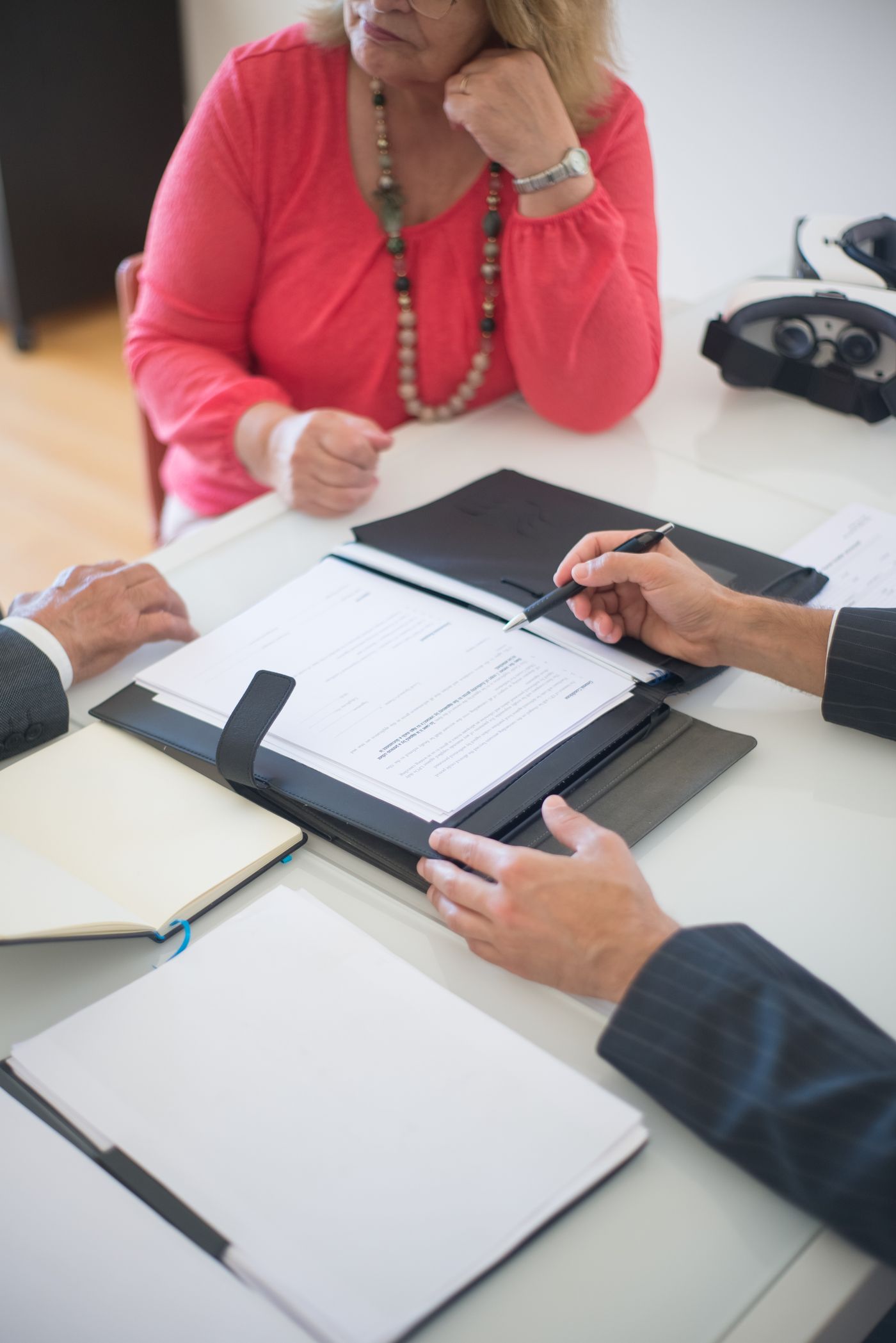 Hands and paperwork at a property consultation